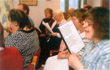 Sight impaired person enjoys worship using a Giant Print hymn book